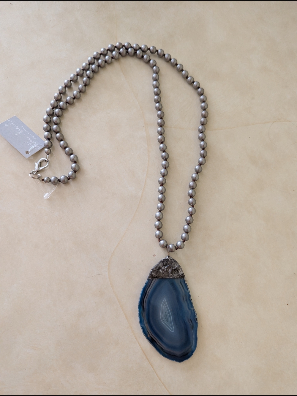 Elegant Gray Beaded Necklace with Blue Agate Pendant